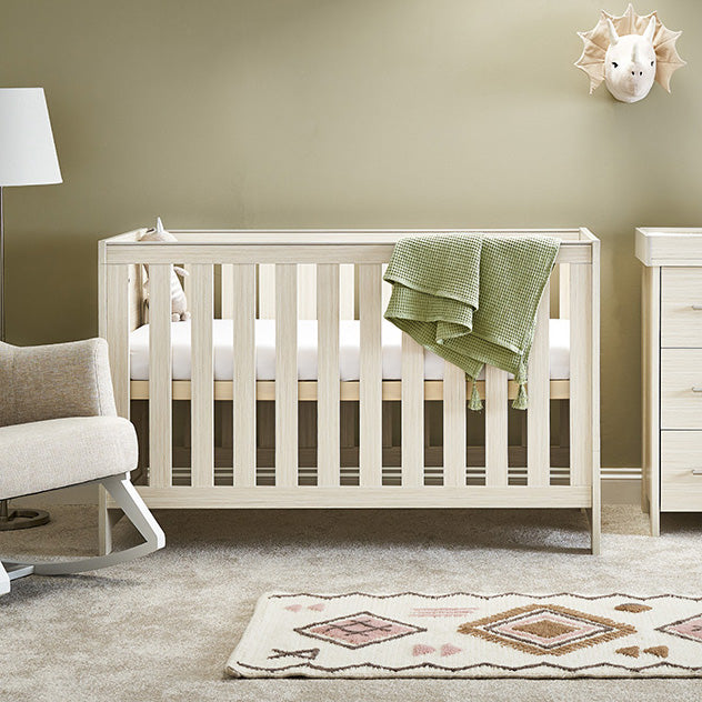 Cot Bed with solid ends, teething rails on the sides & base on new born setting.