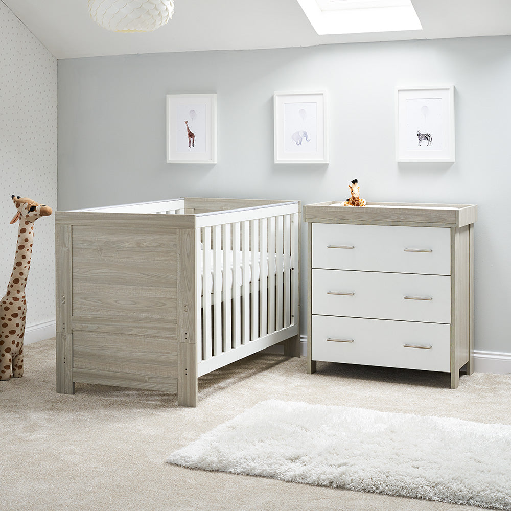 2 Piece Nursery set includes cot bed with solid ends, wood style texture, teething rails & base on the new born setting. Matching changing unit has 3 drawers with metal handle & removable changing top. 